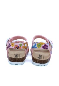 Sandales roses avec des motifs floraux, une semelle en liège, des accents blancs et des brides réglables. Design à dos ouvert avec des semelles texturées.