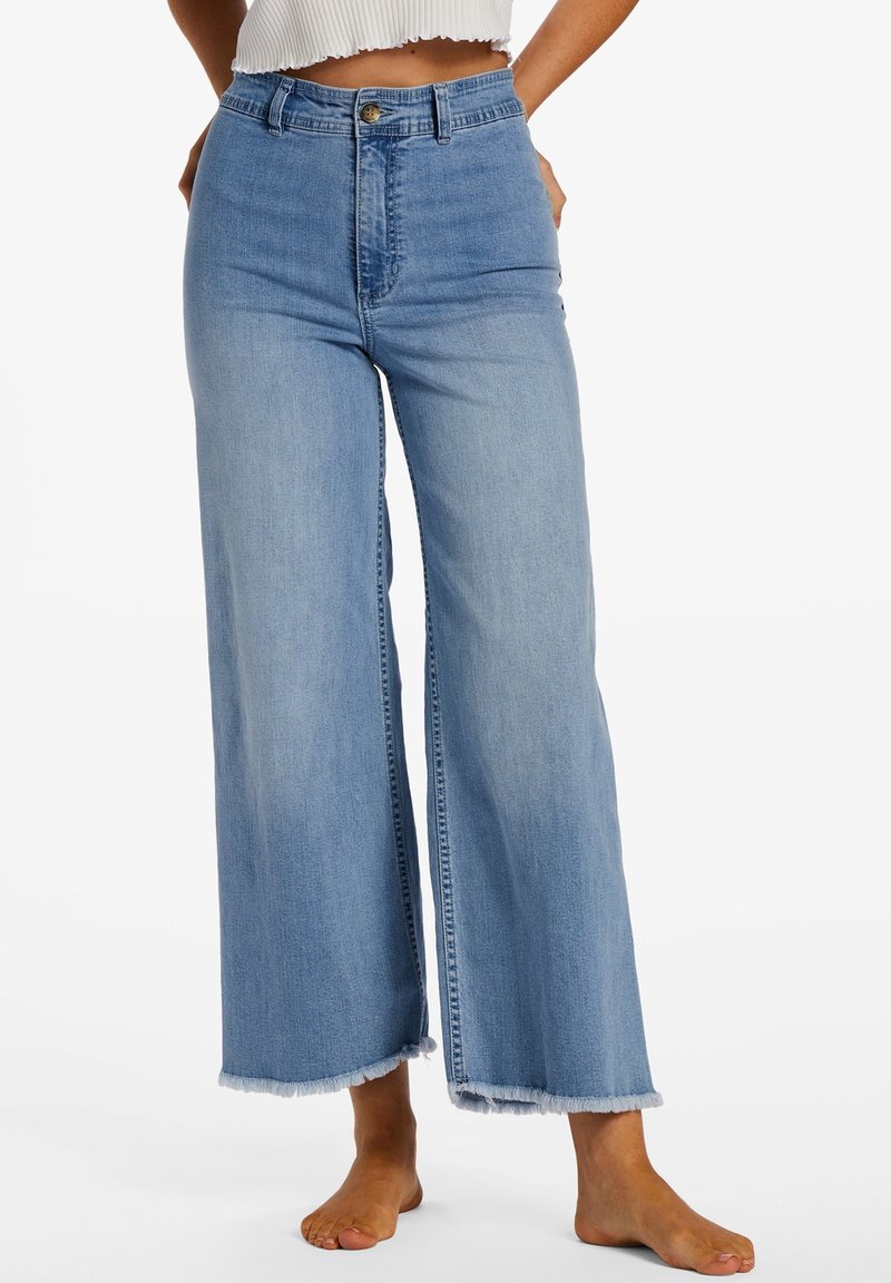 Light blue wide-leg jeans made of denim, featuring a high waist, frayed hem, and a classic button closure.