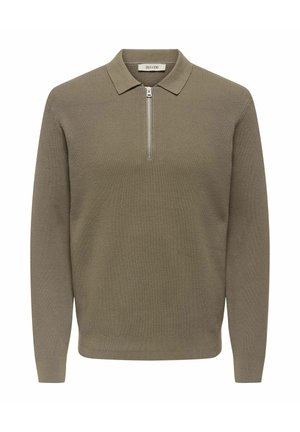 Kaki, ribbad tröja med dragkedja i kragen. Långa ärmar, texturerad tyg och rak fåll. Märkesetikett inuti kragen.
