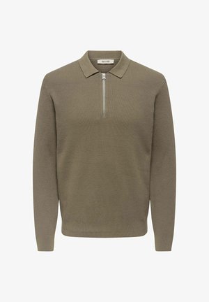 Kaki, rebrana pulover jopica z zadrgo na ovratniku. Dolgi rokavi, teksturirana tkanina in ravna obla. Blagovna znamka z oznako znotraj ovratnika.