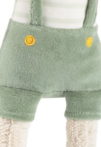 Weiche, grüne Plüschshorts mit gelben Knöpfen, strukturiertem Material und sichtbaren, hellen vertikalen Streifen oben. Kurze, cremefarbene Beine.