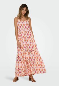 Maxi-Kleid aus leichtem Pfirsichstoff mit bunten geometrischen und floralen Mustern. Spaghetti-Träger und fließendes Design mit lockerer Passform.