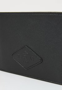 Black leather wallet with textured surface, featuring a diamond-shaped logo embossed with "REPLAY 1981" and contrasting stitching.