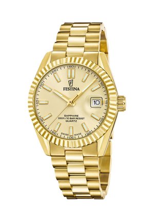 Guld Festina armbåndsur med riffelrunde bezel, gul urskive, lysende markører, datovisning kl. 3 og metalledsarmbånd.