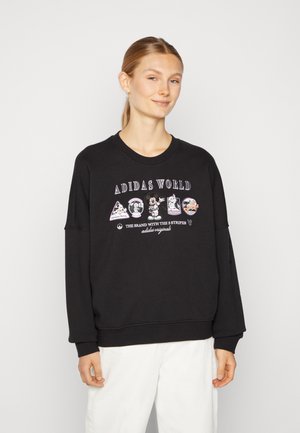 Felpa nera in cotone con collo rotondo, maniche ampie e grafiche con vari personaggi dei cartoni animati sul davanti.