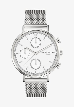 Silberner Edelstahlchronograf mit weißem Zifferblatt, ausgestattet mit Tages- und Datumsunterziffern, Mesh-Armband und minimalistischen Stundenmarkierungen.