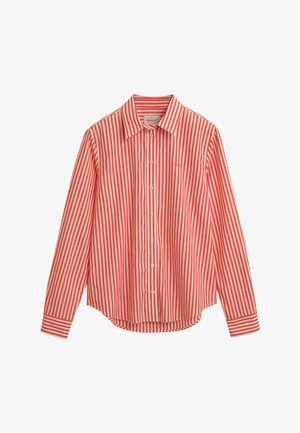 Chemise à manches longues rayée rouge et blanche avec un col boutonné, dotée de boutons sur le devant et d'un ourlet arrondi. Matière en coton.