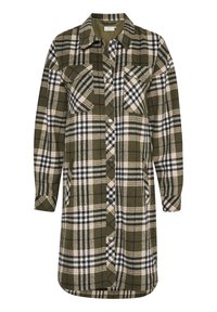 Robe chemise à carreaux verts, manches longues, deux poches poitrine, fermeture à boutons sur le devant et ourlet arrondi. Confectionnée dans un tissu épais et doux.