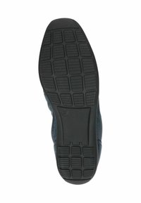 Suola in gomma nera con motivo a griglia testurizzato, che mostra la misura 37. Parte superiore in tessuto scuro parzialmente visibile lungo il lato. Design di scarpa piatta e casual.