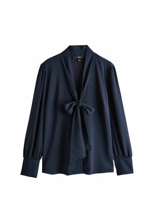 Bluza bleumarin cu mâneci lungi, fundă legată în față și manșete largi, cu decolteu în V și croială lejeră.