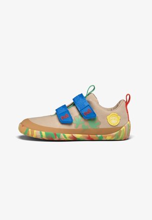Beige children's shoe with blue double straps, green plant design, yellow brand patch, multicolor sole, and green and red pull tabs.
