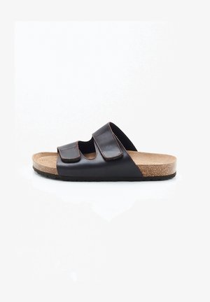 Sandalia de cuero marrón con dos correas ajustables, plantilla de corcho y suela de goma negra texturizada. Diseño abierto en la punta, acabado liso.