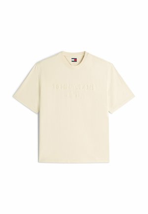 Cream short-sleeve crew neck T-shirt with embossed "Tommy Jeans" text and small Tommy Hilfiger flag logo on inner collar.