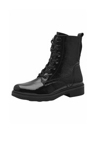 Bottines noires en cuir verni brillant, présentant un laçage sur le devant, un bout rond et un petit talon carré. Tirant à l'arrière pour un enfilage facile.
