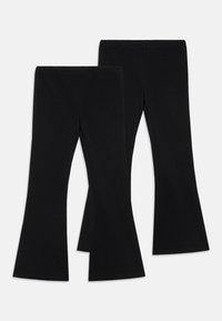 Leggings noires évasées en tissu extensible, avec une taille haute et une texture lisse. Elles ont une ouverture large au bas.