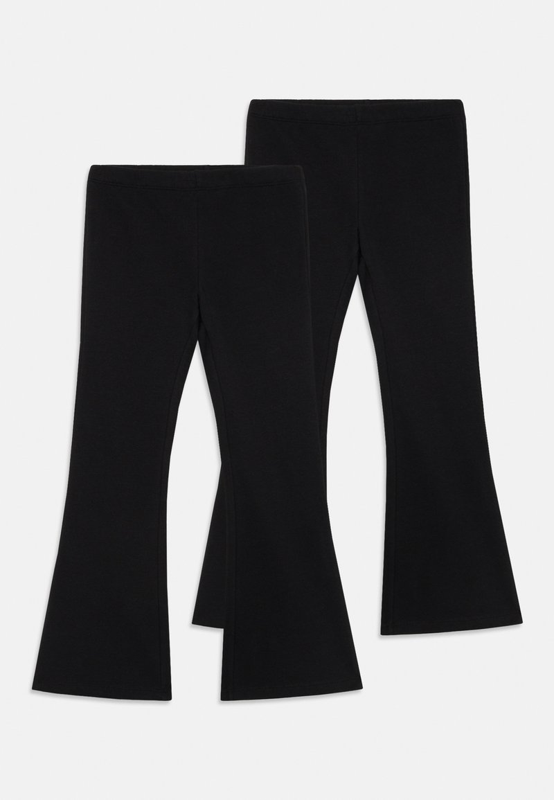 Leggings noires évasées en tissu extensible, avec une taille haute et une texture lisse. Elles ont une ouverture large au bas.