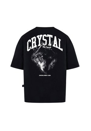 T-shirt nera oversize con una grafica di un lupo e il testo "CRYSTAL Paris" in lettere bianche grassetto sul retro. Materiale in cotone morbido.