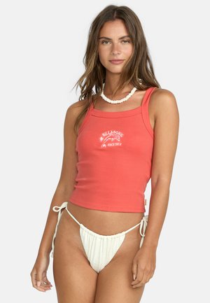 Coral ribbed tank top with white Billabong logo, featuring wide straps and a fitted design. Paired with white drawstring bikini bottoms.