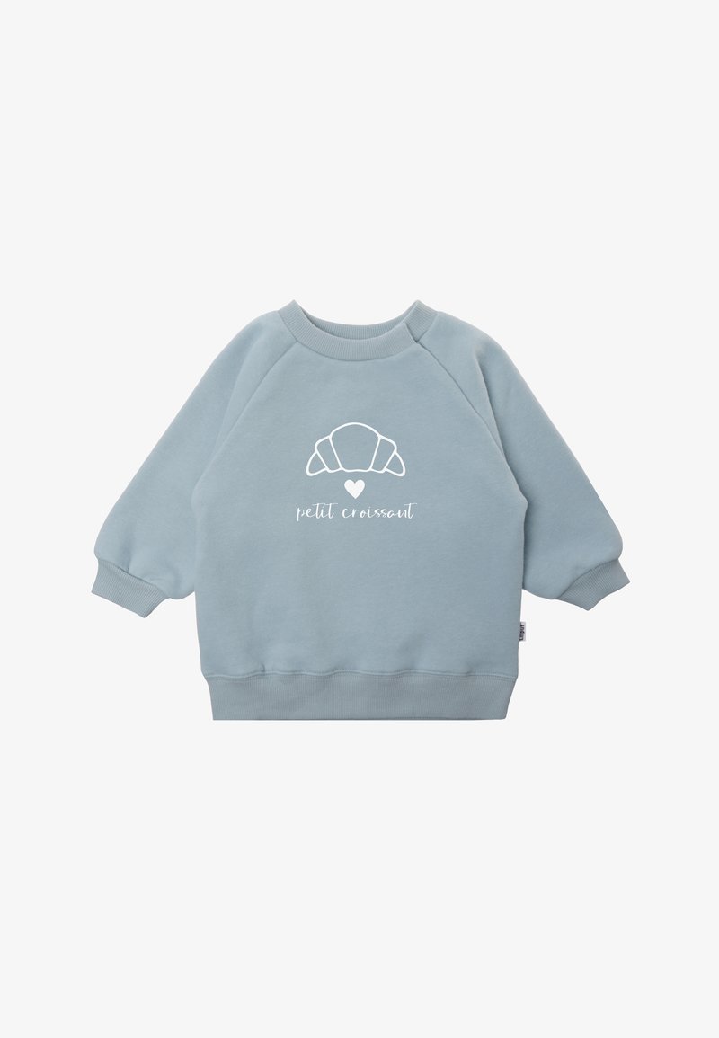 Hellblaues Sweatshirt mit Raglanärmeln. Auf der Vorderseite befindet sich ein weißes Croissant-Graphic und der Text "petit croissant". Weicher Stoff.