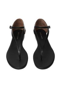 Black leather sandals with a flat, smooth sole. Features a thong design and ankle strap. Includes a subtle logo inside and minimal hardware.