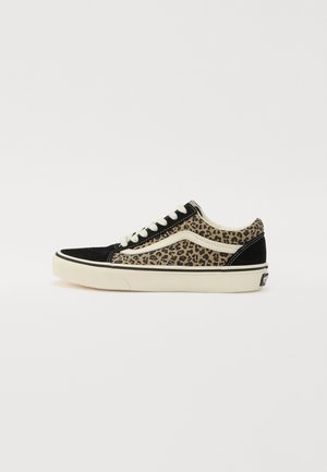 Black and brown leopard print sneaker with a suede upper, white laces, and cream rubber sole. Features contrasting black toe cap and heel.