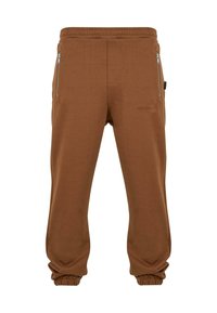 Pantalons de jogging marron en tissu doux, dotés d'une taille élastique, de poches zippées et de poignets côtelés aux chevilles.