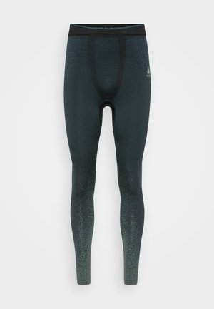 Zwarte en donkergroene sportleggings met een gevarieerd patroon, voorzien van een hoge tailleband en verstevigde stiksels langs de randen.