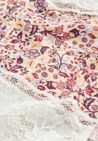 Cotton fabric with a floral pattern in burgundy, lavender, and yellow, bordered by intricate white lace. Textured and lightweight.
