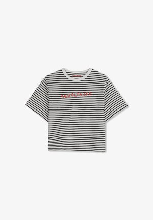 Striped cropped t-shirt in white and black fabric. Features short sleeves and red embroidered text "REVOLTAIRE" across the front.