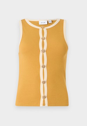 Haut sans manches côtelé jaune moutarde avec bordure crème et six boutons décoratifs en forme de fleurs au centre devant.