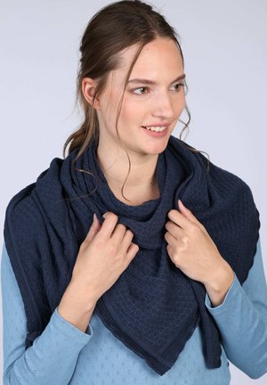 Navy textured shawl with a triangular shape, featuring a patterned knit and scalloped edges, draped around the neck.