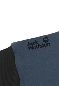 Giacca in pile di colore blu scuro con dettagli neri. Presenta il logo "Jack Wolfskin" inciso e un tessuto strutturato per calore e comfort.