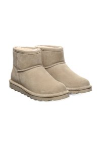 Ein Paar beige Wildleder-Stiefeletten mit Fleece-Futter und Gummisohlen, entworfen für Wärme und Komfort.