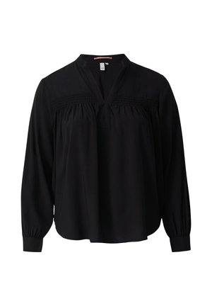 Blouse noire à manches longues avec décolleté en V, détail smocké sur la poitrine, forme fluide et poignets élastiques. Tissu léger avec une texture lisse.