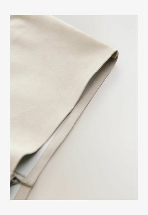 Kreemivärvi kangas, millel on pehme ja sile tekstuur, kerge volditud puhta servaga. Lame disain, minimalistisch välimus.