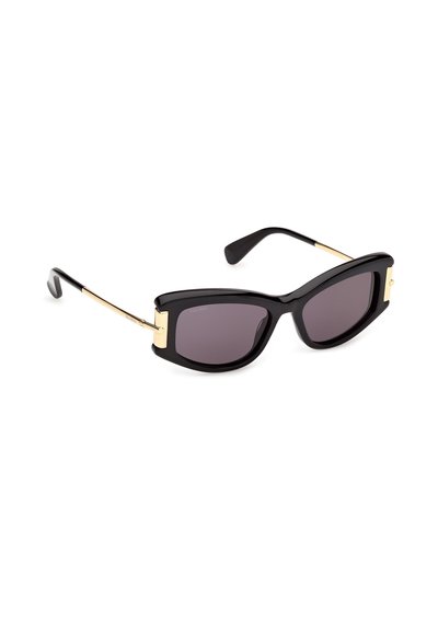 Black cat-eye sunglasses with dark lenses and slim gold metal arms, resting on a white background.