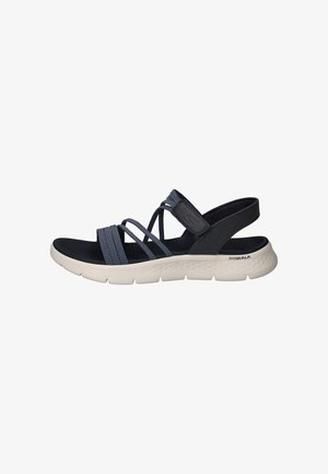 Marineblauwe sport sandalen met elastische banden, een gevormde binnenzool en een gestructureerde donkere zool. Voorzien van een witte, gevoerde tussenzool en logo-accent.