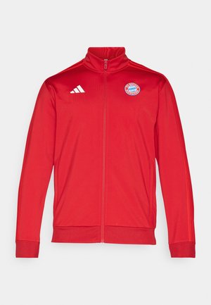 Red athletic jacket with a high collar, full zip, featuring white Adidas logo and Bayern Munich emblem. Smooth texture and fitted design.