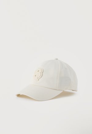 Off-white baseball cap with curved brim and a textured floral "B" embroidered on the front panel, displayed on a plain background.