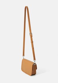 Tan leather crossbody bag with a rectangular shape, adjustable strap, and silver hardware. Smooth texture with minimal detailing.