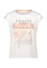 T-shirt blanc à manches courtes, avec un motif floral couleur pêche et un texte argenté portant les mots "PEACH SMILE" et "BE YOU."
