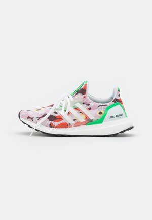 Running shoe with multicolor floral knit pattern, white laces, green heel support, white boost sole, and black outsole, side view.