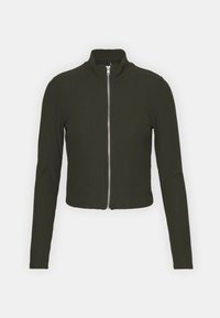 Dark green cropped zip-up jacket, ribbed texture, high collar, long sleeves, silver zipper at front, fitted design.