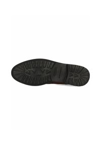 Semelle en caoutchouc noir avec des crampons profonds, présentant une surface texturée et un grip à motifs pour l'adhérence. Zone du talon renforcée pour plus de durabilité.