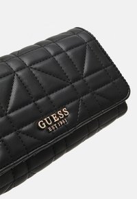 Guess ASSIA CROSSBODY FLAP ORGANIZER - Skuldertasker - black