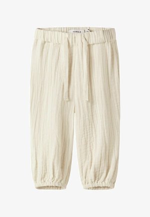 Pantaloni per bambini color crema con vita elasticizzata, coulisse, tessuto strutturato e polsini elasticizzati.