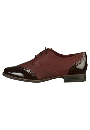 Burgunderfarvet lædersko med en blank, mørkebrun tåhætte og hæl, med brogue-detaljer og tre snørehuller. Lav, stablet hæl.