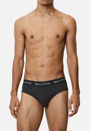 Schwarze Baumwollslips mit einem weichen Bund, der das weiße Branding "Marc O'Polo" aufweist. Sie haben eine enge Passform und einen klassischen Schnitt.