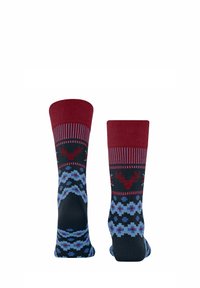 Chaussettes en laine avec un bord bordeaux uni, une base bleu foncé, un motif de rennes rouges et un motif floral dans des nuances de bleu et de rouge.