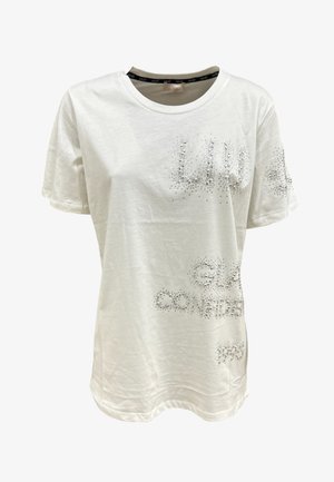 T-shirt bianco in cotone con maniche corte, caratterizzato da scritte in strass scintillanti sul davanti, scollatura rotonda e vestibilità rilassata.